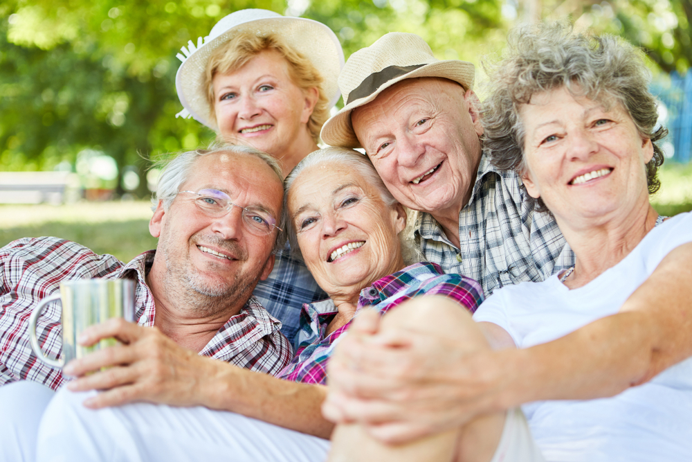 Group of happy senior citizens in summer